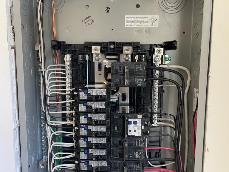 Neatly wired residential electrical panel with new breakers