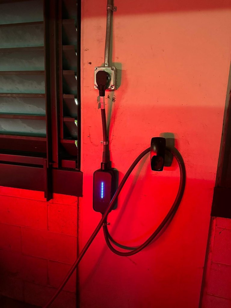 EV charger plugged into a new outdoor outlet
